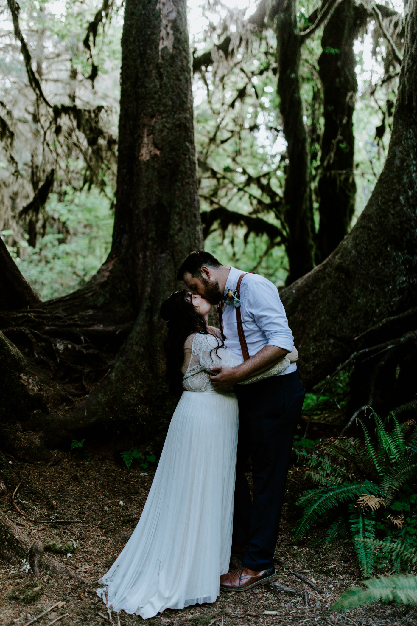 Jack and Brooke kiss in the woods. Elopement photography at Olympic National Park by Sienna Plus Josh.