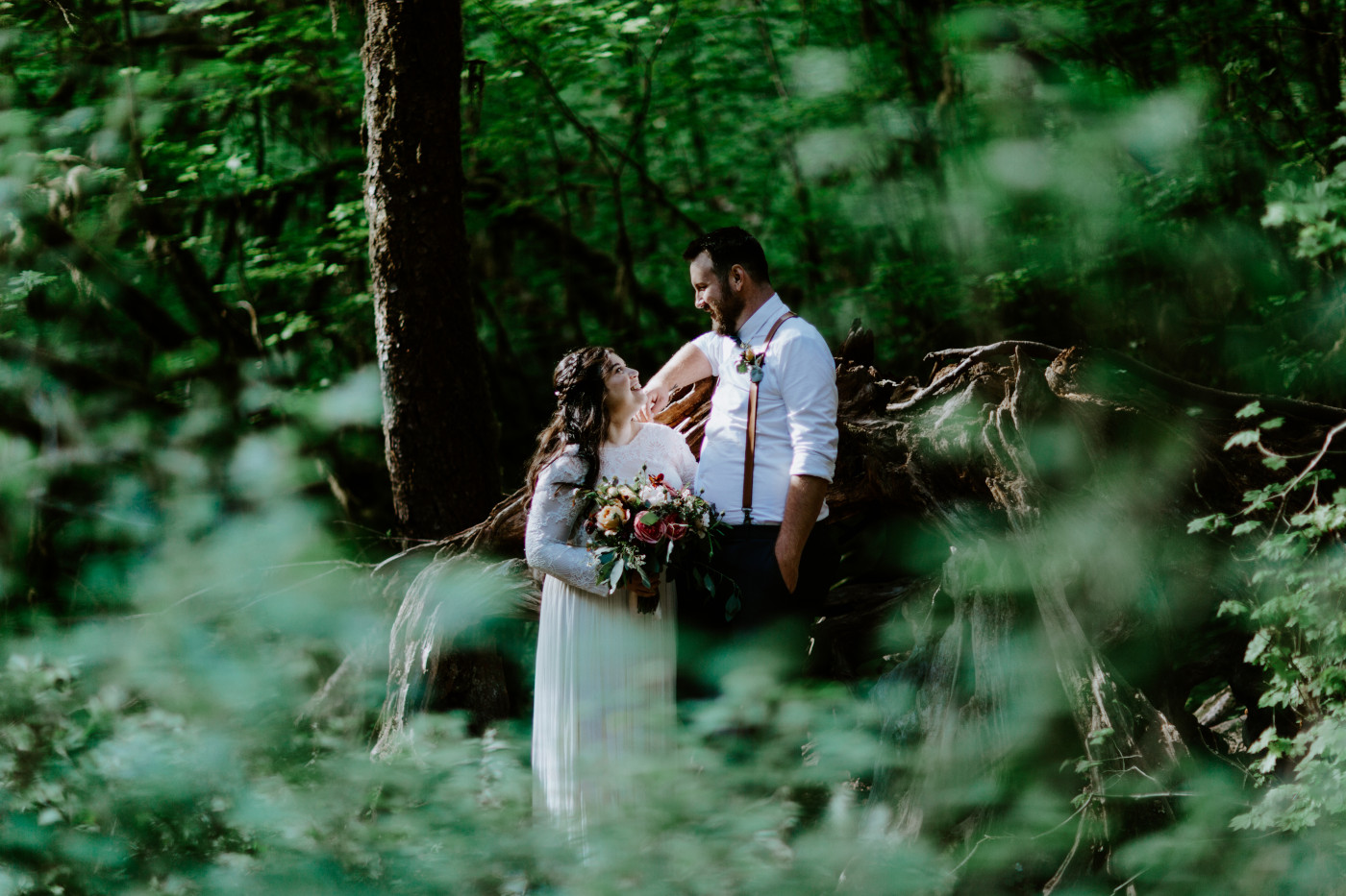 Brooke and Jack standing near a log. Elopement photography at Olympic National Park by Sienna Plus Josh.