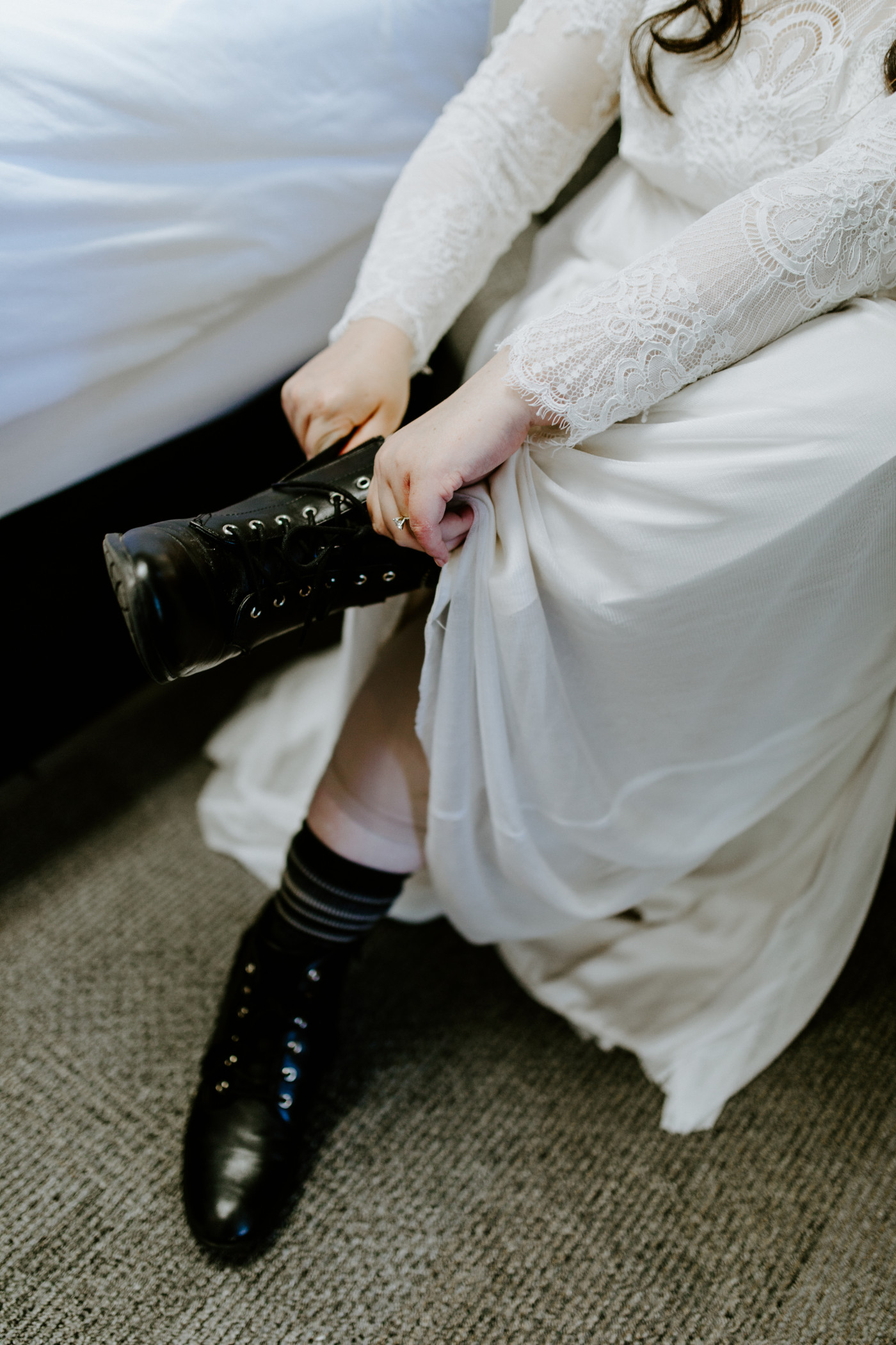 Brooke puts on her boots. Elopement photography at Olympic National Park by Sienna Plus Josh.