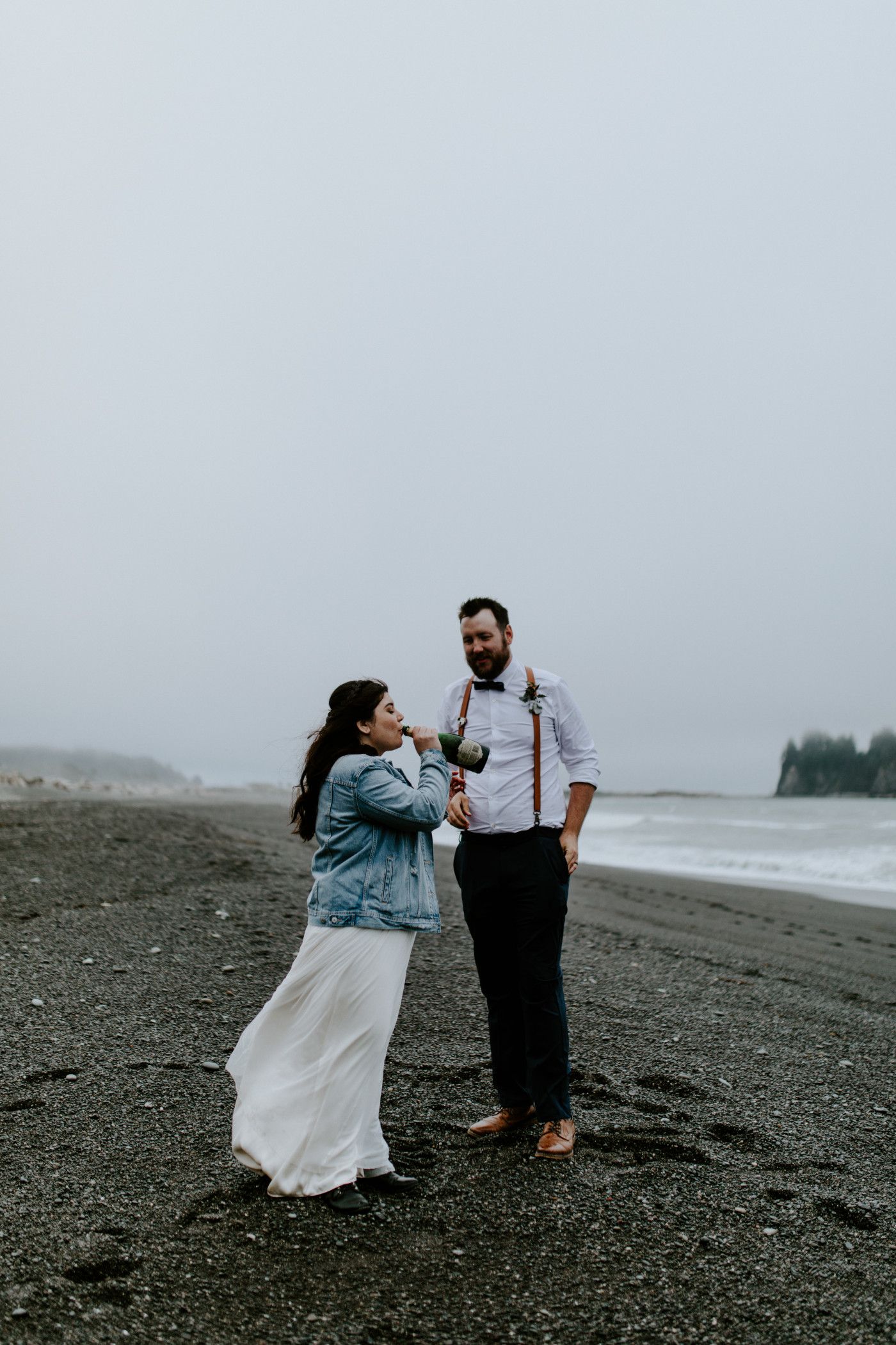 Brooke drinks some champagne out of the bottle. Elopement photography at Olympic National Park by Sienna Plus Josh.