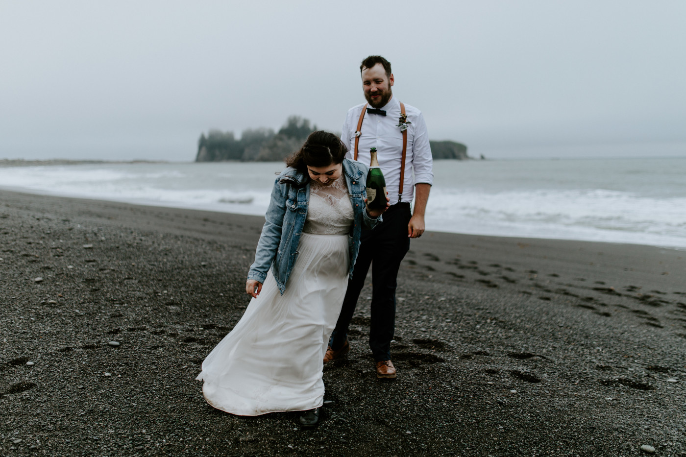 Brooke holds the bottle of champagne. Elopement photography at Olympic National Park by Sienna Plus Josh.