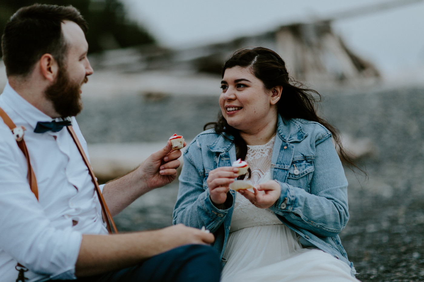 Brooke and Jack eat cupcakes on the beach. Elopement photography at Olympic National Park by Sienna Plus Josh.
