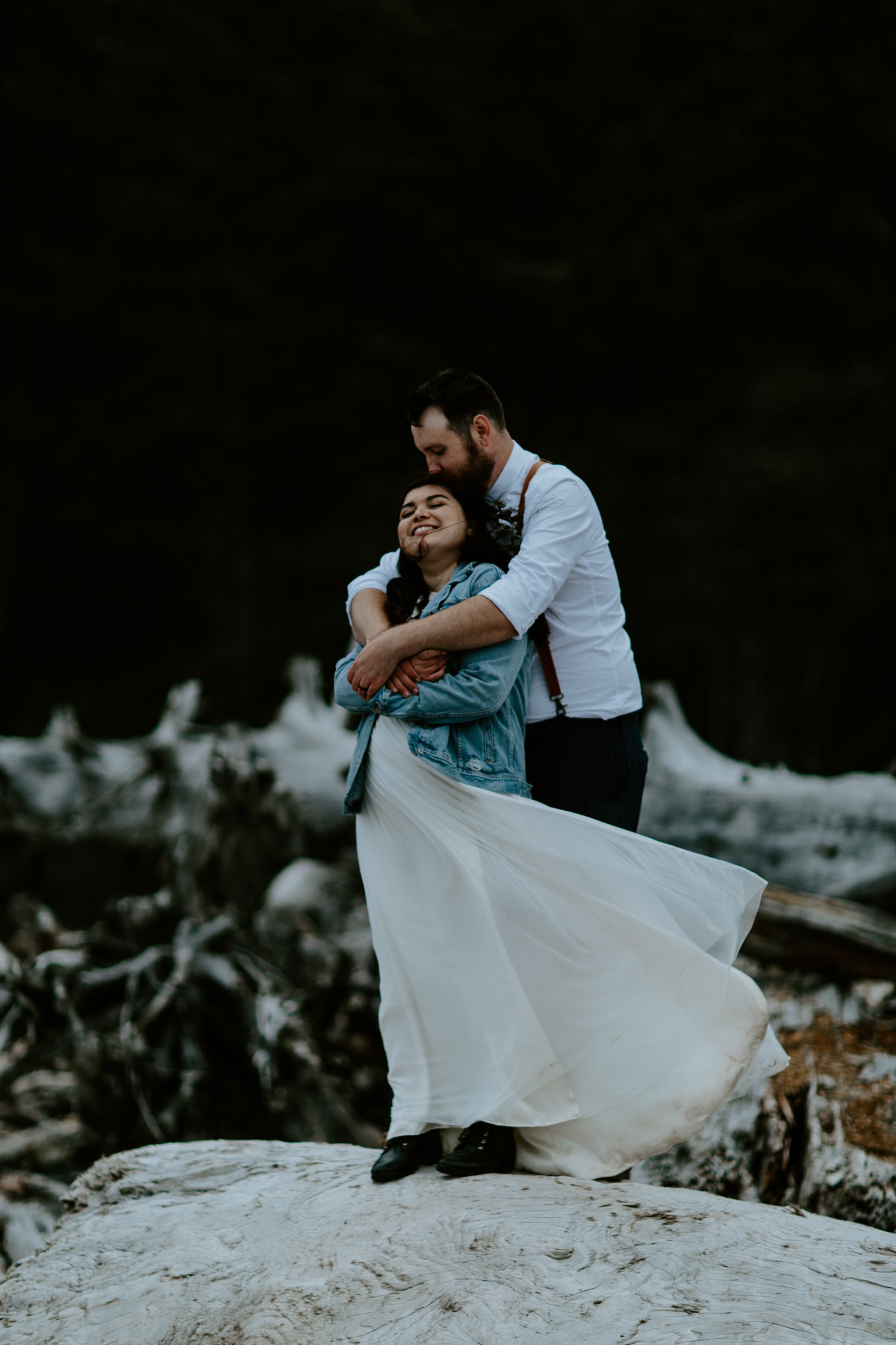 Jack hugs Brooke on the beach. Elopement photography at Olympic National Park by Sienna Plus Josh.