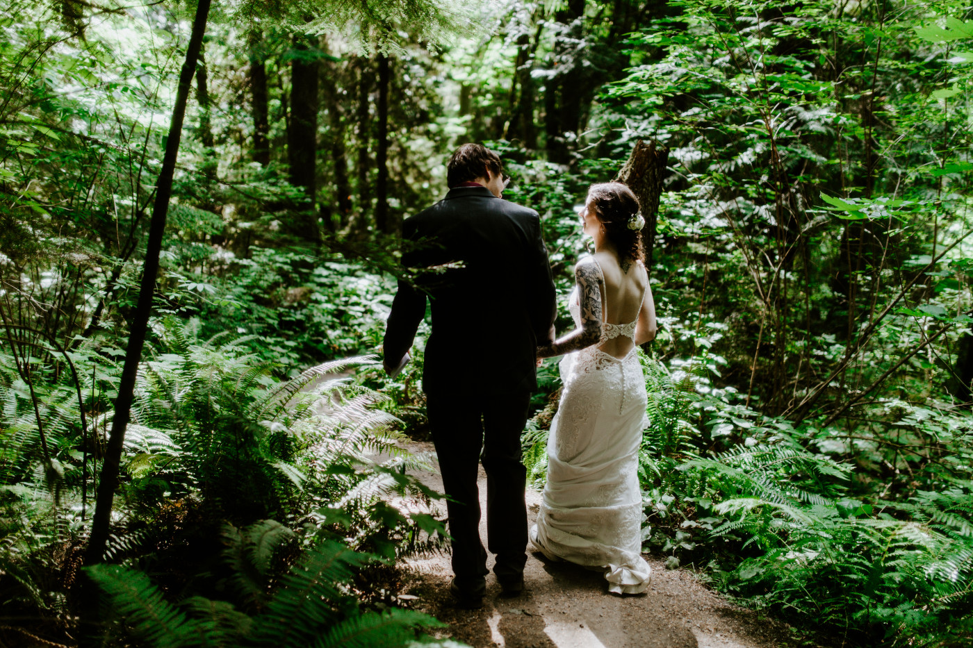 Coty and Adrielle walk through the woods at Olympic National Park, Washington.