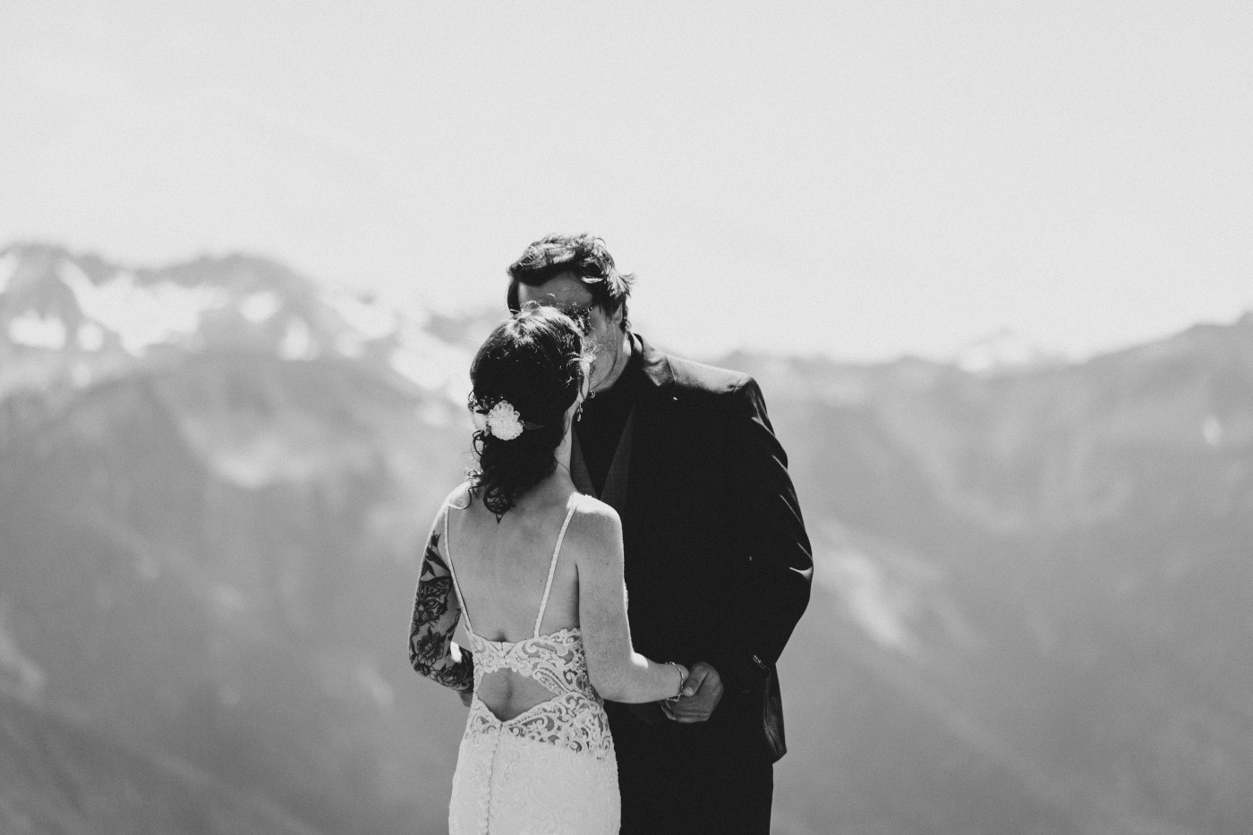 Adrielle and Coty stand near a cliff at Olympic National Park, Washington.