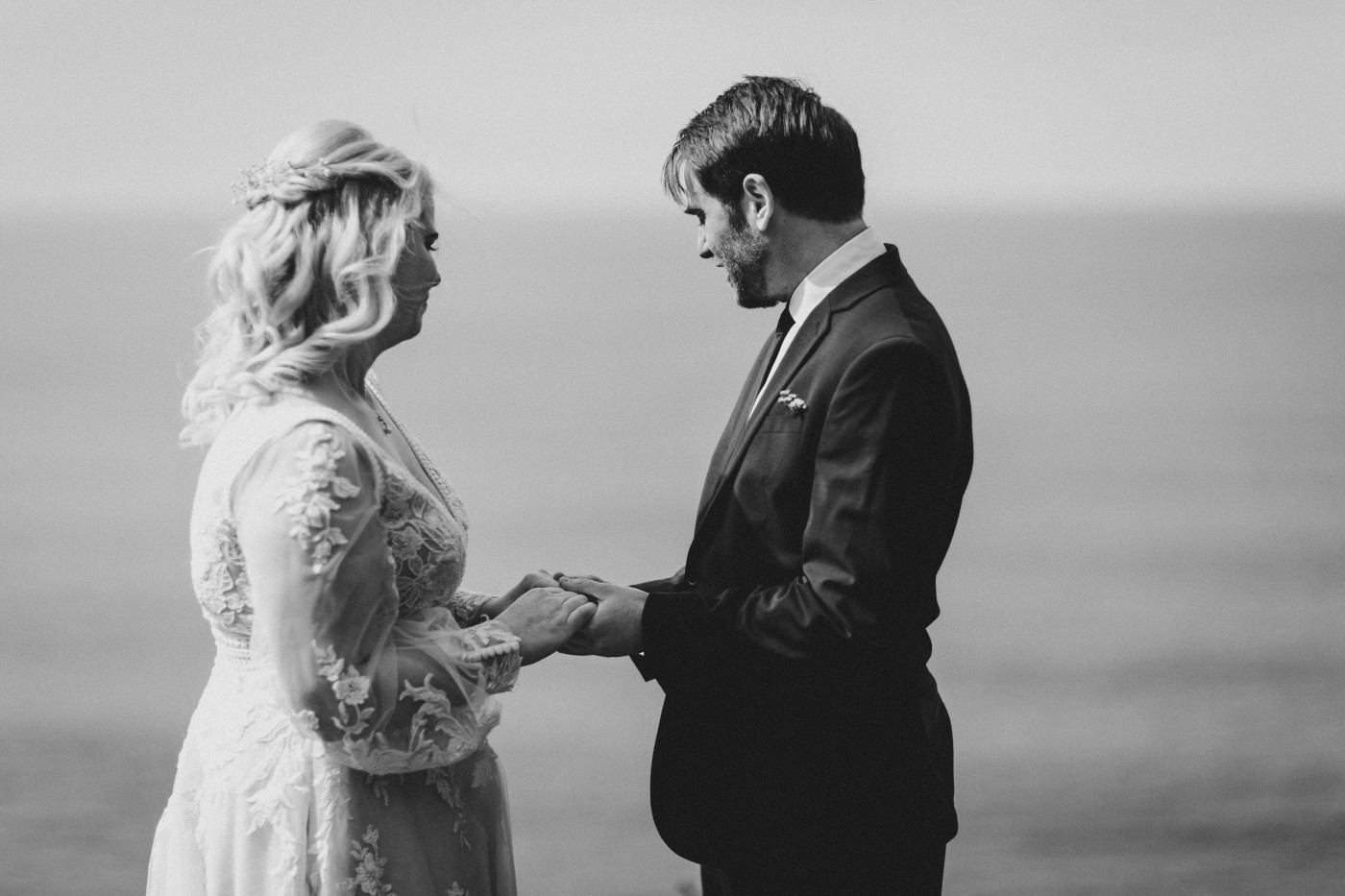 Katie and Ben recite their vows at the Oregon coast during their elopement ceremony.