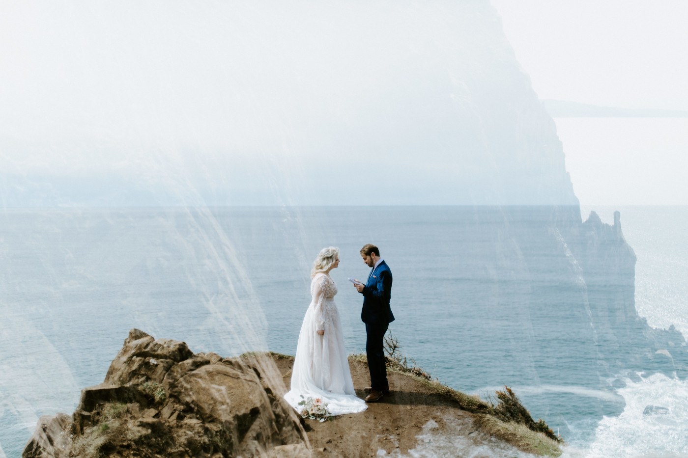 Ben says his vows to Katie at the Oregon coast during their elopement ceremony.