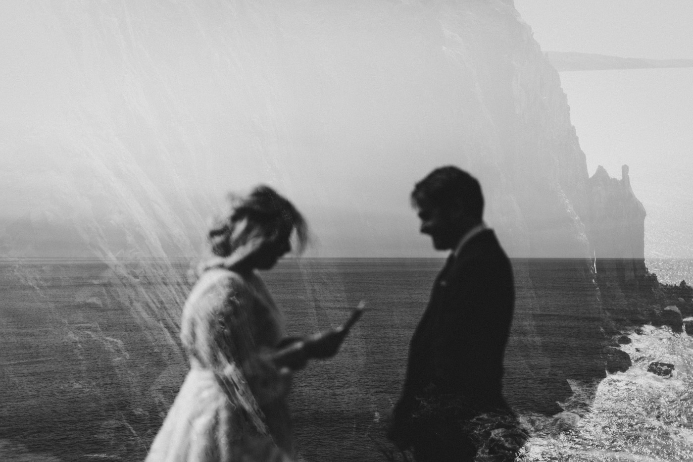 Katie and Ben go in for a kiss at the Oregon coast during their elopement ceremony.