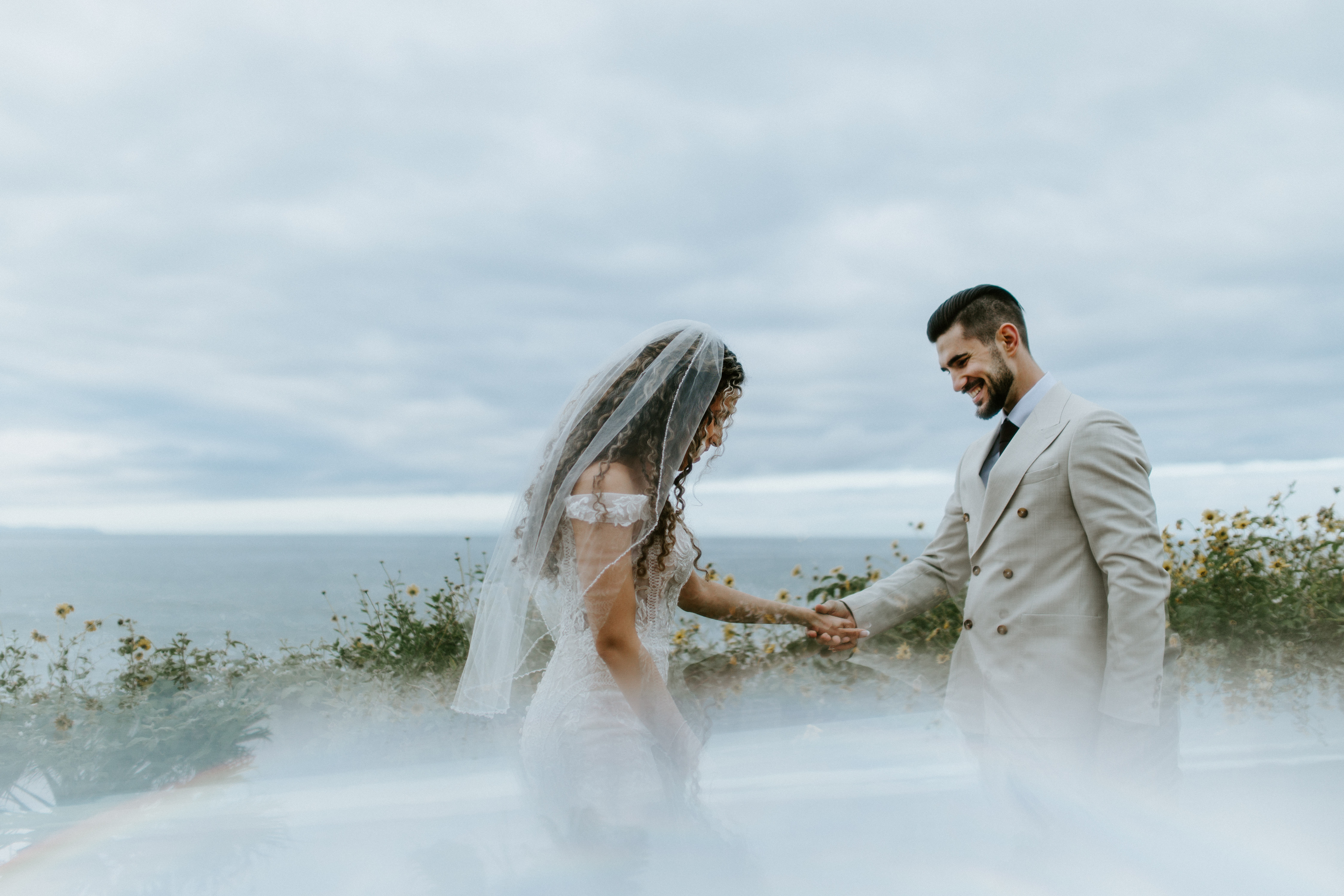 A couple stands near the beach in Santa Barbara, California.