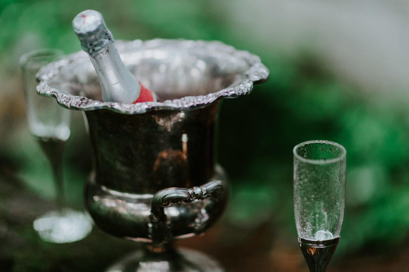 Champagne sits in a chilled silver bucket at Skamania House, Washington. Elopement photography in Portland Oregon by Sienna Plus Josh.