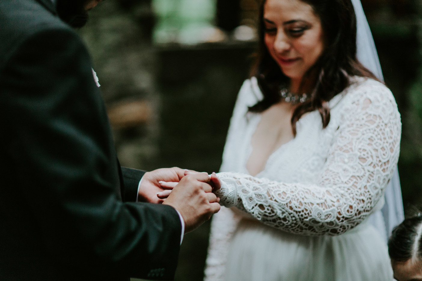 Sam puts a ring on Sarah's finger at Skamania House. Elopement photography in Portland Oregon by Sienna Plus Josh.