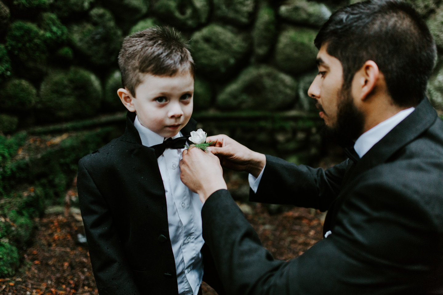 Sam gets his son ready for the ceremony in Skamania, Washington. Elopement photography in Portland Oregon by Sienna Plus Josh.