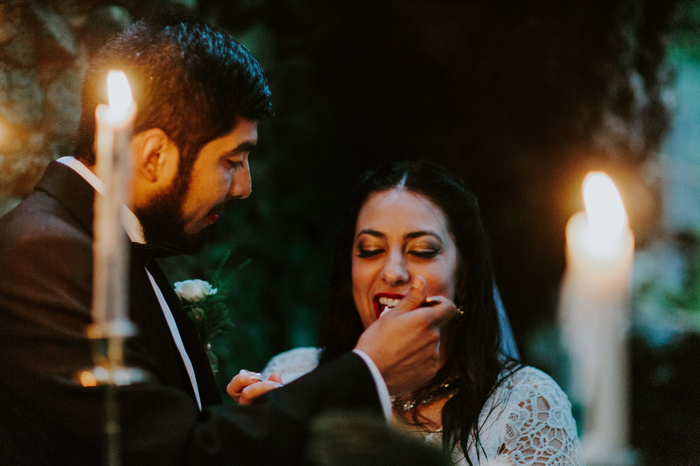 Sarah and Sam feed each other cake at Skamania House, Washington. Elopement photography in Portland Oregon by Sienna Plus Josh.
