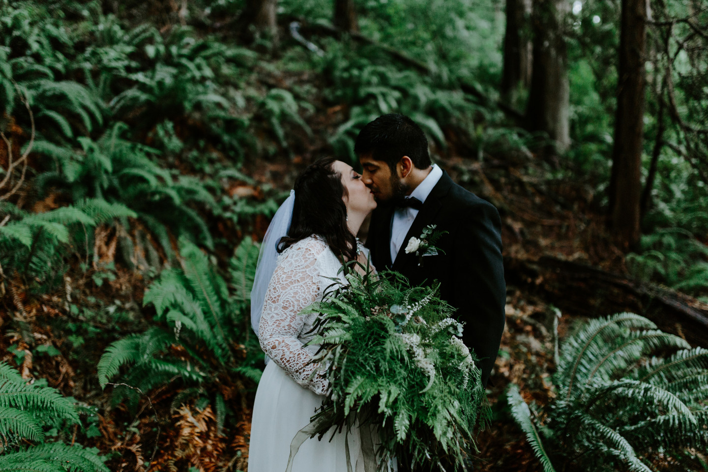 Sam and Sarah kiss at Skamania House in Oregon during their Adventure. Elopement photography in Portland Oregon by Sienna Plus Josh.