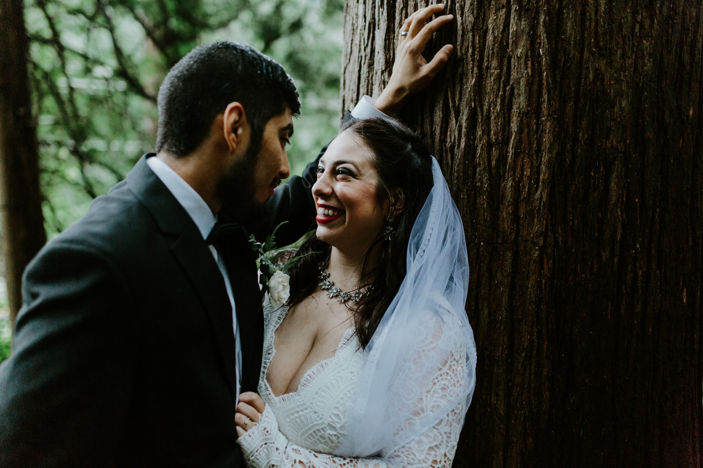 Sarah and Sam share a moment under a tree at Skamania House, Washington. Elopement photography in Portland Oregon by Sienna Plus Josh.