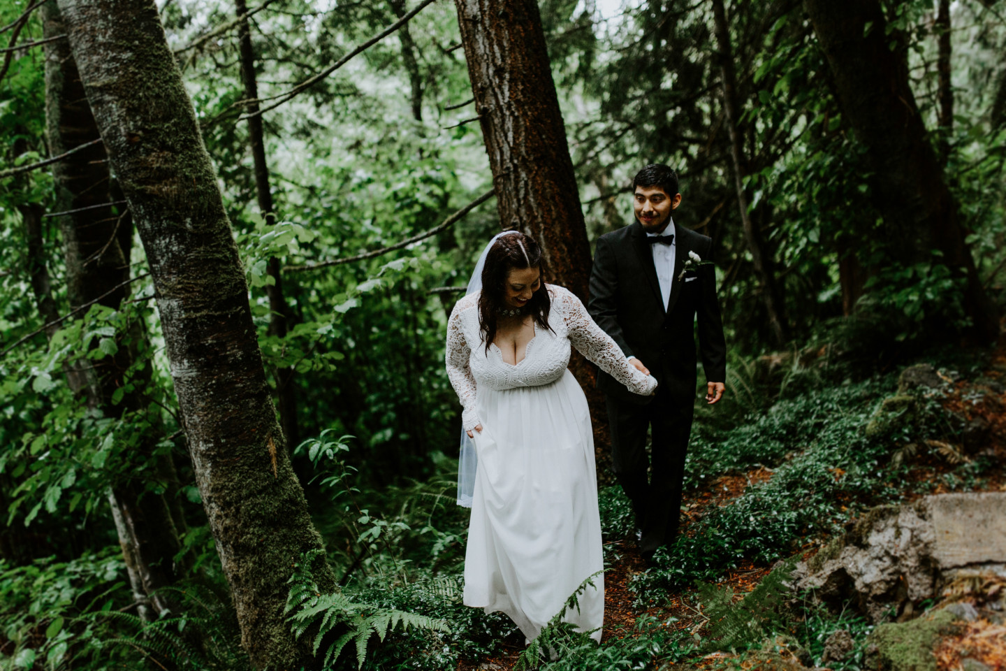 Sarah leads Sam through the forest at Skamania House, Washington. Elopement photography in Portland Oregon by Sienna Plus Josh.