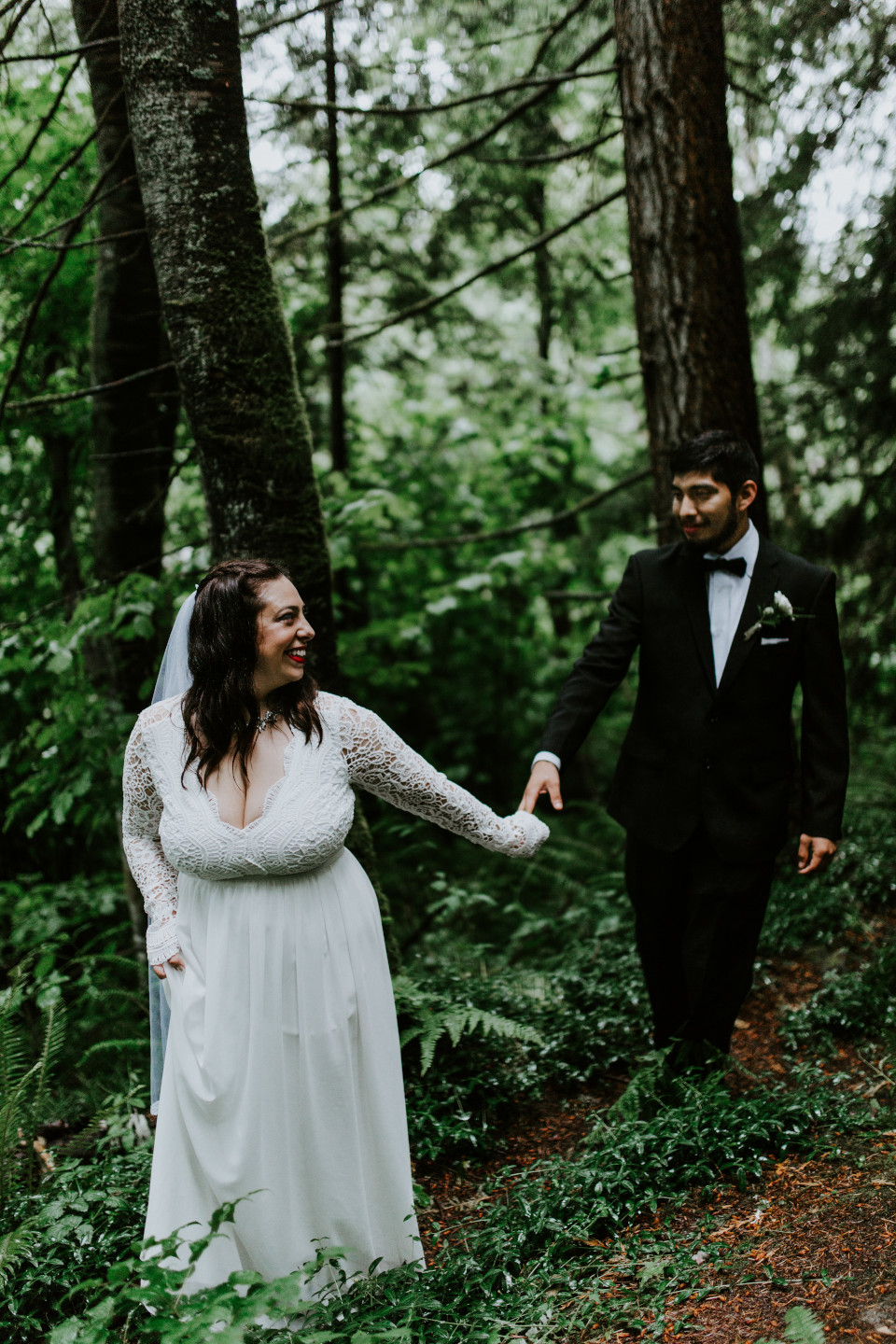 Sarah and Sam hold hands at Skamania House, Washington. Elopement photography in Portland Oregon by Sienna Plus Josh.
