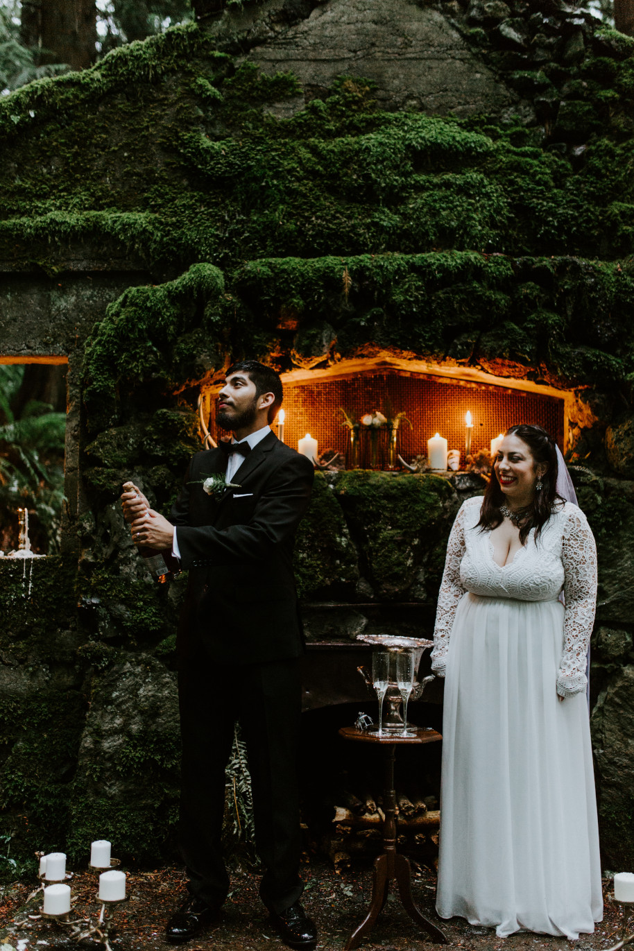 Sam pops open a bottle of Champagne at Skamania House, Washington. Elopement photography in Portland Oregon by Sienna Plus Josh.