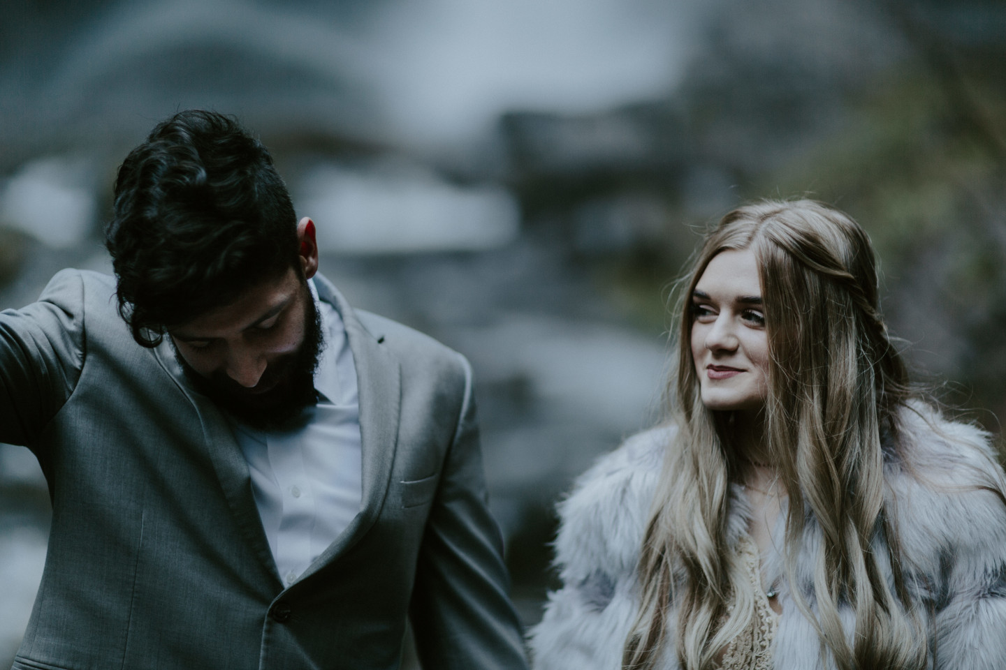 Tyanna and Boris stand together, newly married at Latourell Falls, OR. Adventure elopement in the Columbia River Gorge by Sienna Plus Josh.