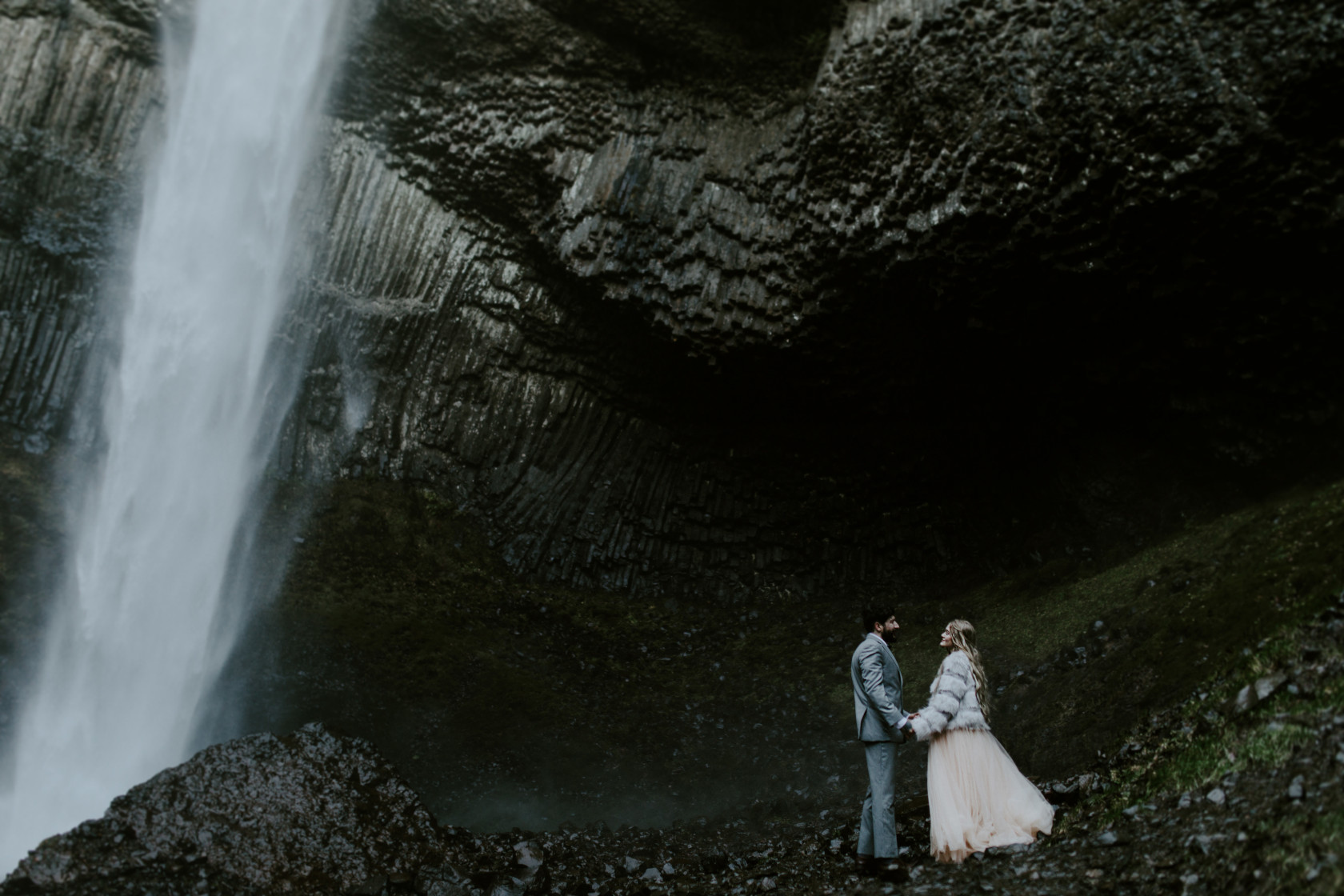Boris and Tyanna stand together near Latourell Falls, OR. Adventure elopement in the Columbia River Gorge by Sienna Plus Josh.