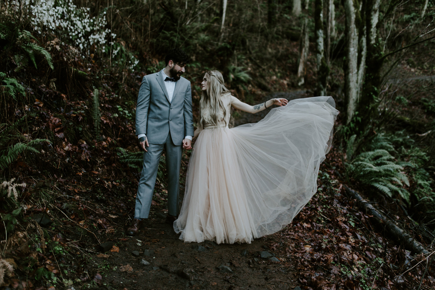 Boris and Tyanna admire each other. Adventure elopement in the Columbia River Gorge by Sienna Plus Josh.