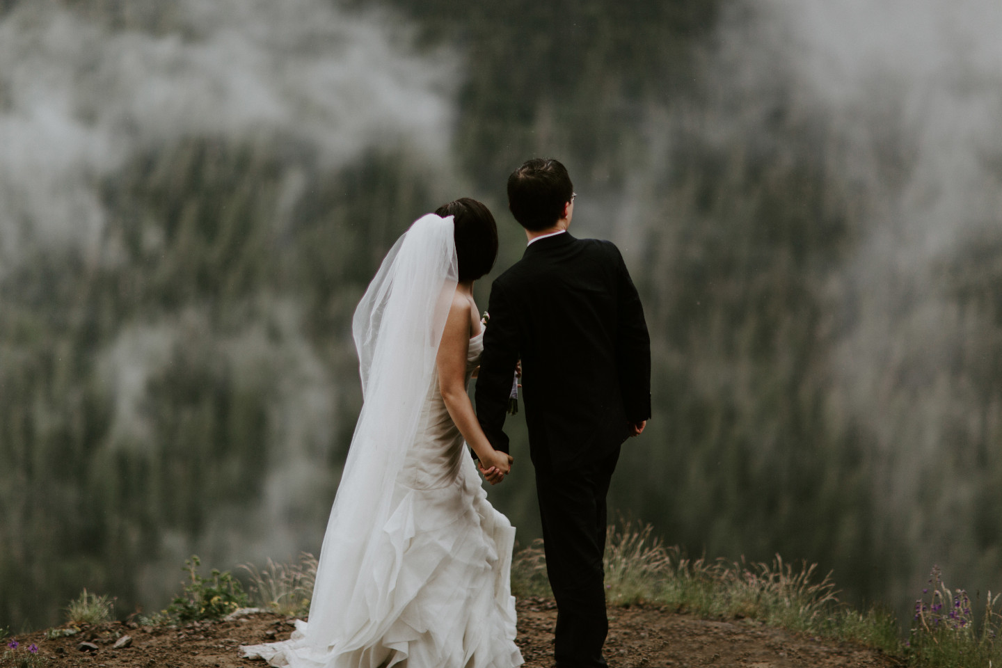 Alex and Valerie watch the clouds part near Mount Hood. Elopement wedding photography at Mount Hood by Sienna Plus Josh.