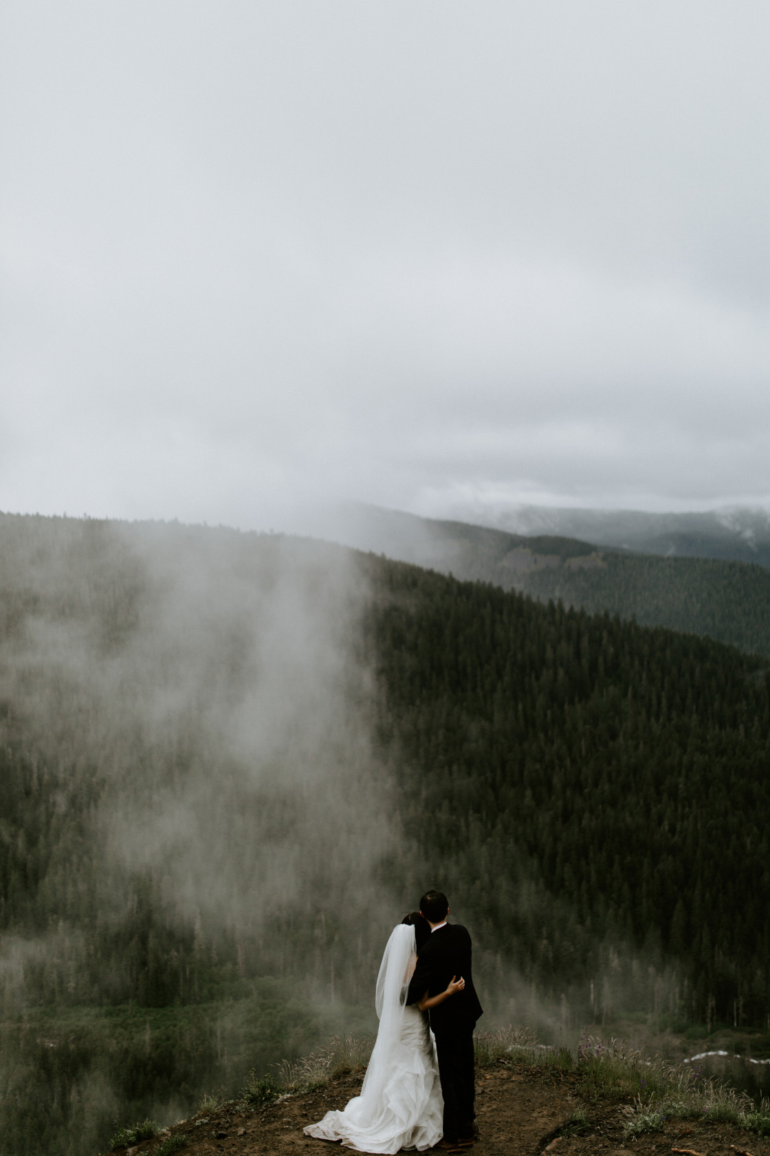 Alex and Valerie face each other with a view of the ravine near Mount Hood. Elopement wedding photography at Mount Hood by Sienna Plus Josh.