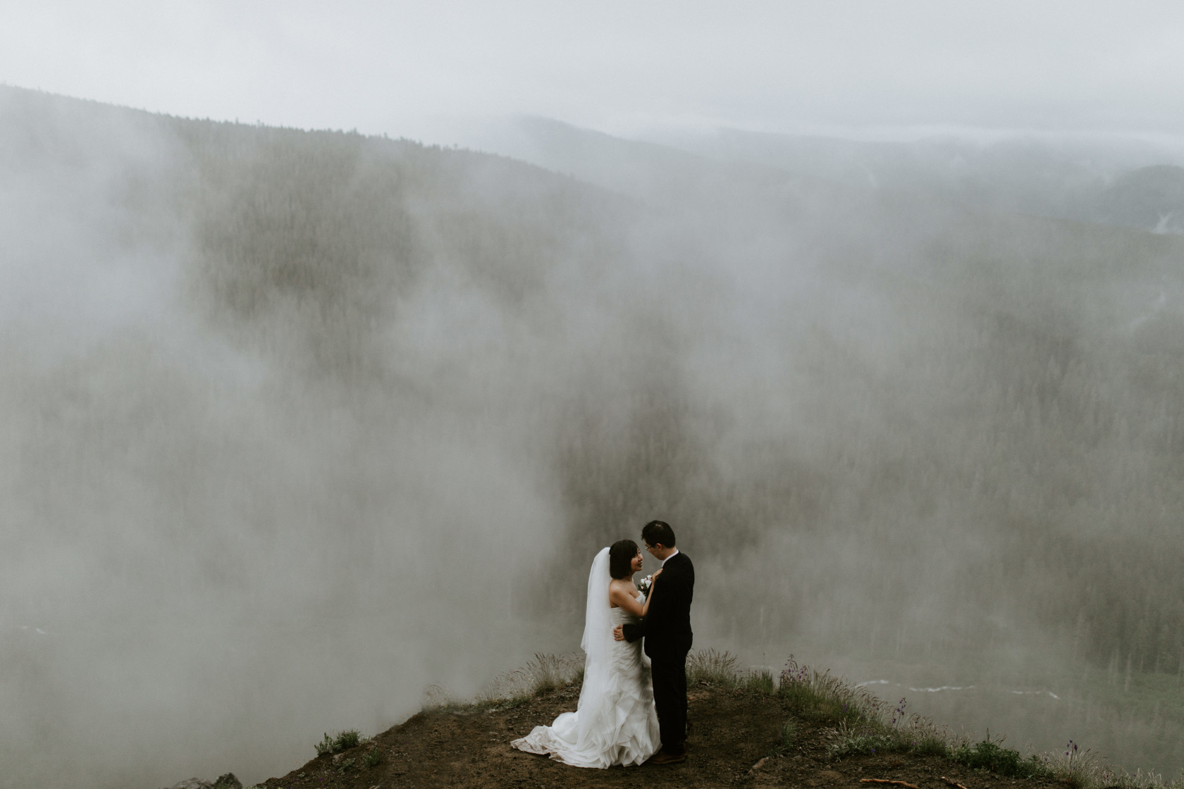 Alex and Valerie stand before the fog. Elopement wedding photography at Mount Hood by Sienna Plus Josh.