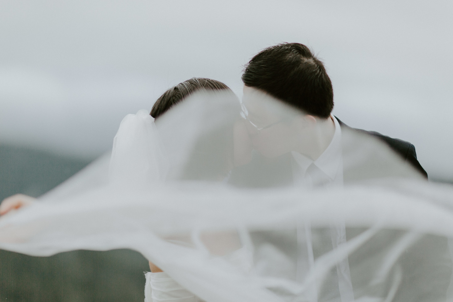 Valerie throws her veil up into the wind. Elopement wedding photography at Mount Hood by Sienna Plus Josh.