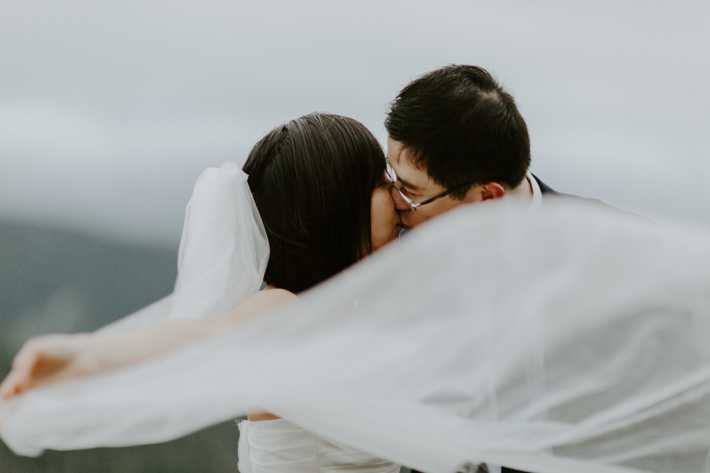 A shot through the veil as Valerie and Alex kiss at Mount Hood, OR. Elopement wedding photography at Mount Hood by Sienna Plus Josh.