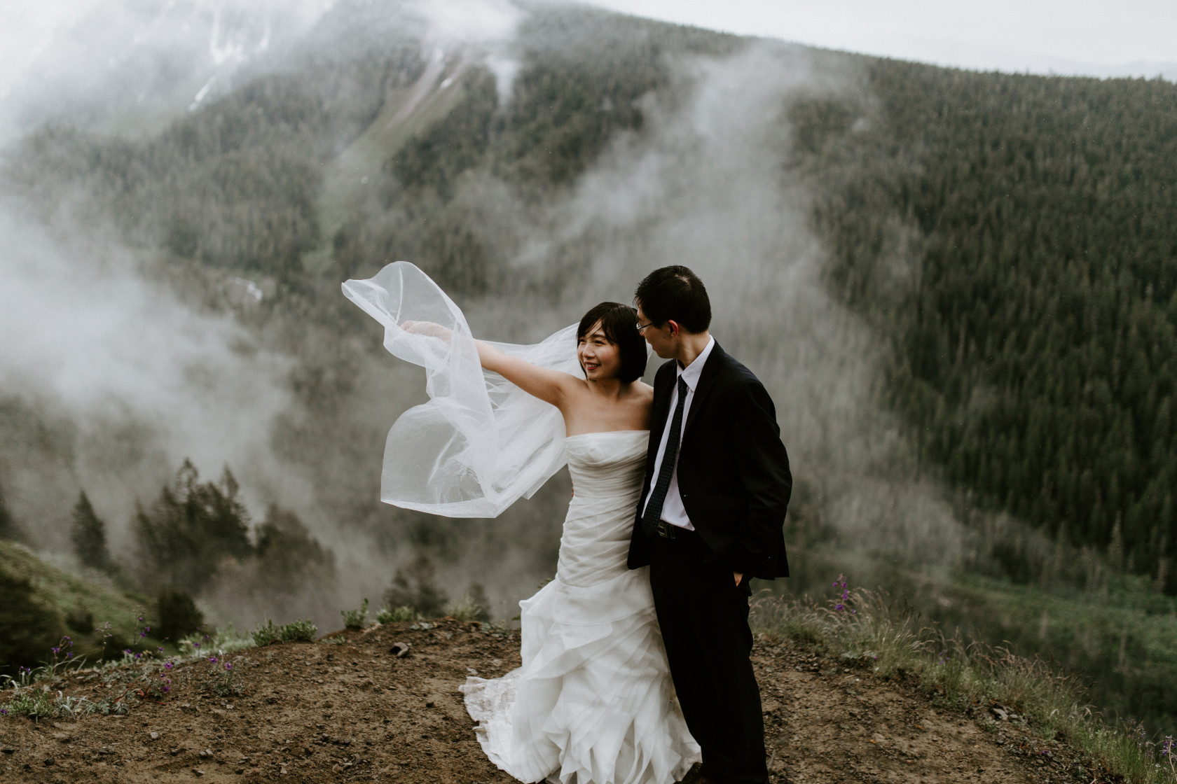 Valerie tosses her veil into the wind. Elopement wedding photography at Mount Hood by Sienna Plus Josh.