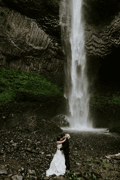 A gif of Alex and Valerie in front of a waterfall. Elopement photography by Sienna Plus Josh.