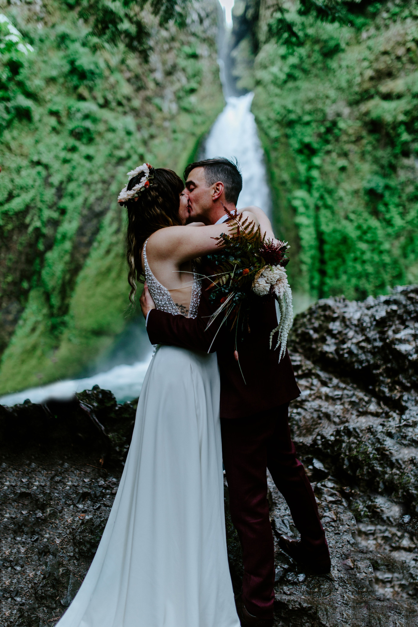 Jordan and Andrew kiss in front of Wahcella Falls.
