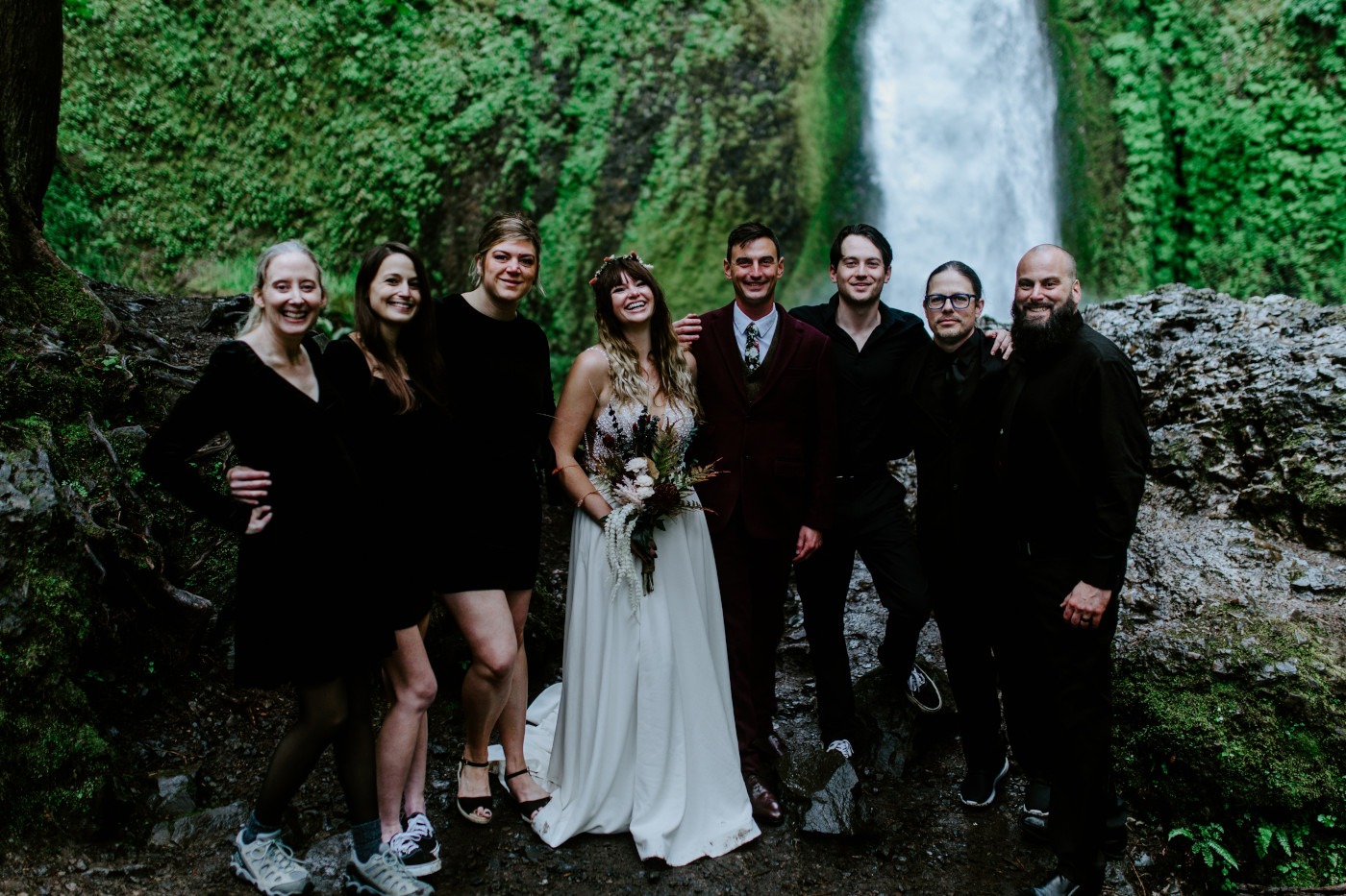 A group photo of the elopement wedding party at Wahcella Falls.