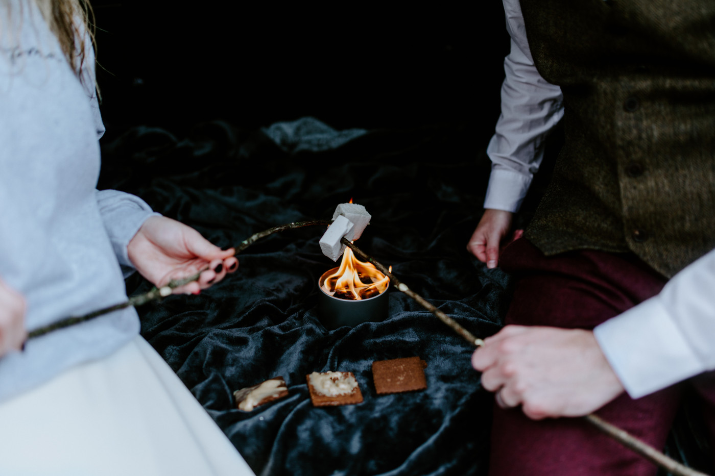 Jordan and Andrew roast marshmallows on a portable stove.