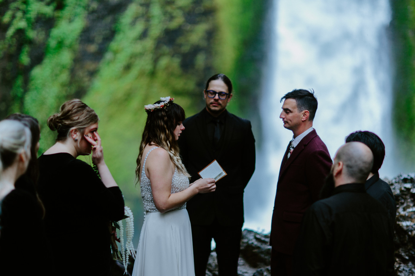 Jordan reads her vows at Wahcella Falls.
