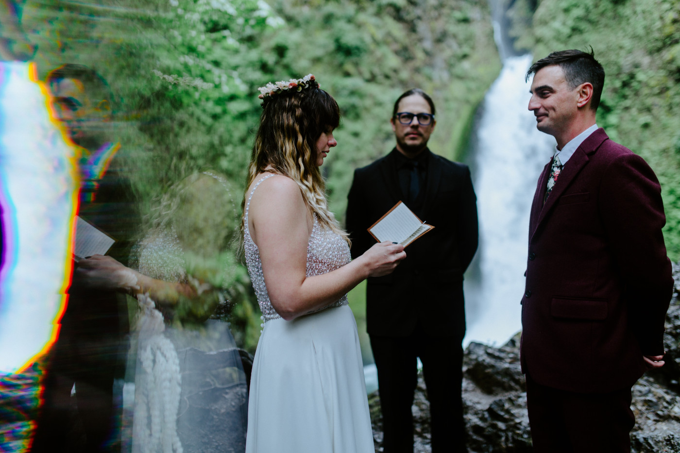 Jordan reading her vows to Andrew in front of Wahcella Falls for their elopement ceremony.